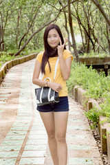 Attractive young woman enjoying her time outside in public park