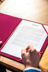 Naklejka premium sign contract / the manager signs the official contract on the parties' agreement 
