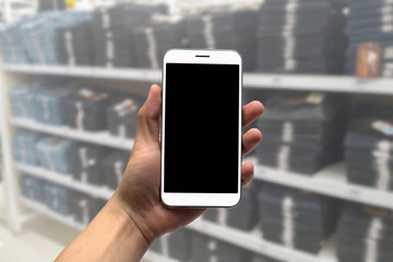 Blurred photo, Blurry image, Jeans on the shelves, background