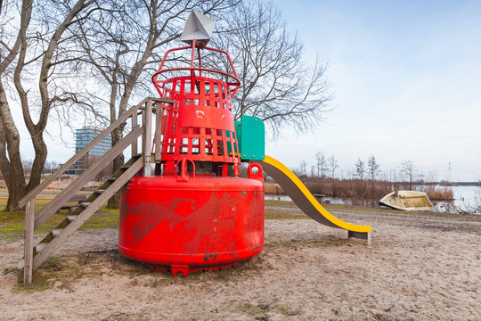 Slide made of red buoy on public playground