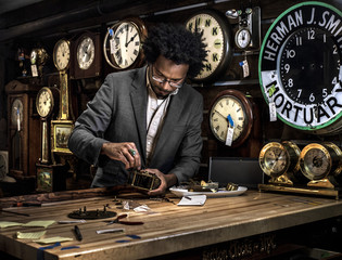 Clockmaker in his workshop