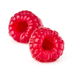 two ripe raspberries isolated on white background close up