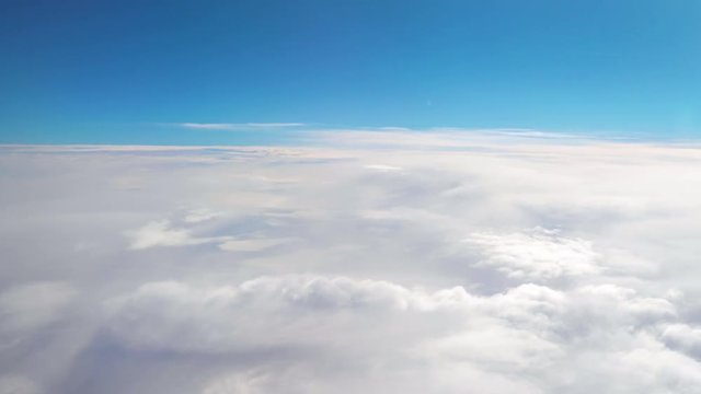 Aerial shot above the clouds in 4K