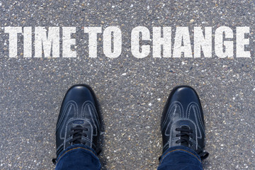 Top View of Business Shoes on the floor with the text: Time to change
