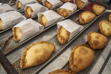 Bolivian Saltenas, traditional bolivian meat and potatoe baked food in market