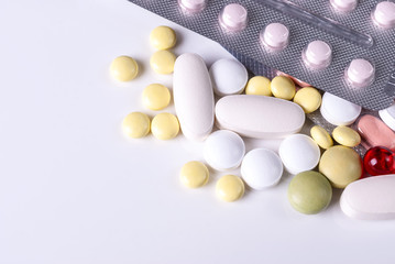 Colorful of antibiotic capsule pills in blister reatment on white background