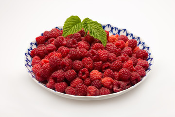 plate of ripe raspberry