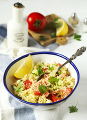 Lemon couscous. Couscous with tomato, cucamber, lemon and herbs. Traditional Arabic Salad Tabbouleh