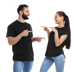 Young couple in t-shirts on white background. Mockup for design