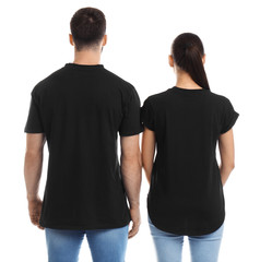 Young couple in t-shirts on white background. Mockup for design