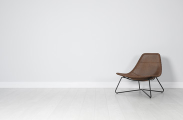 Stylish comfortable armchair indoors. House interior element - obrazy, fototapety, plakaty