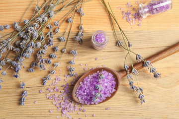 Fototapeta na wymiar Flat lay composition with lavender flowers and natural cosmetic on wooden background