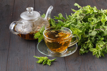 Cups of mint tea on table