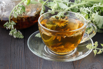 Cups of mint tea on table