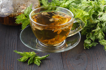 Cup of herbal tea with fresh herbs