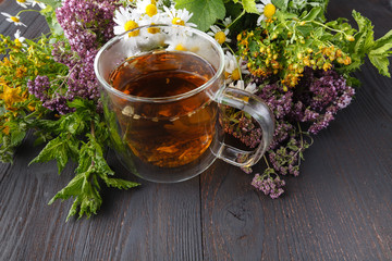 Cup of herbal tea with fresh herbs