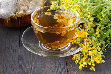 Cup of hot herbal tea. Home scene with hot drink. Detox or clean food concept