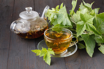 Cup of hot herbal tea. Home scene with hot drink. Detox or clean food concept