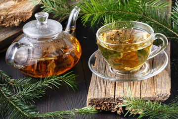 Healthy Tea with fresh herbs on rural table
