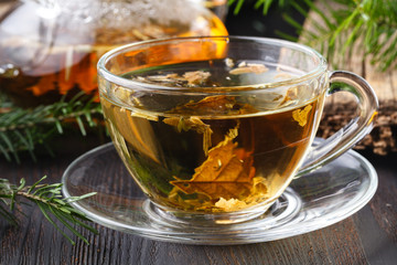 Healthy Tea with fresh herbs on rural table