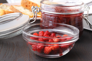 Healthy vegan breakfast. Oatmeal granola with oat milk and berries over wooden table background. Clean eating, weight loss, vegetarian, raw food concept