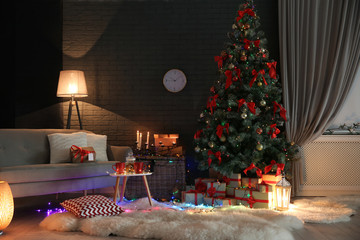 Stylish room interior with decorated Christmas tree