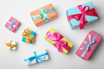 Flat lay composition with beautiful gift boxes on white background