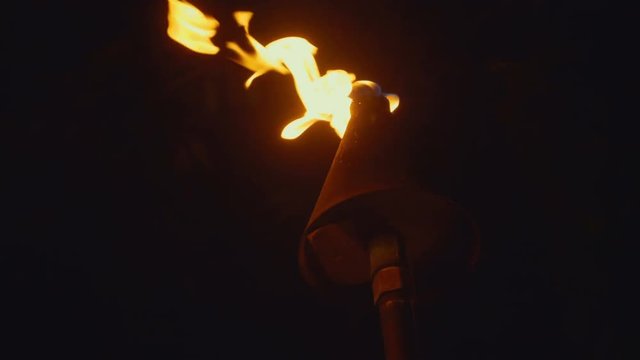 Professional video of Tiki Torch Flames in Waikiki beach, Honolulu Hawaii in 4k slow motion 60fps