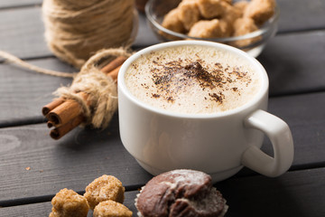hot black coffee with cookies and beans in cafe