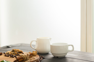 hot black coffee with cookies and beans in cafe