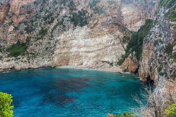Blue water and rocks of beach at Zakynthos island, Greece