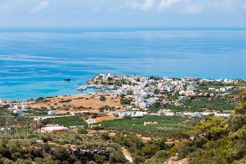 Naklejka na ściany i meble Makrigialos unique skyline aerial view, south east Crete Greece. Popular Mediterranean travel destination vacation resort, unspoiled beaches, clear turquoise ocean waters. Travel destination concept. 