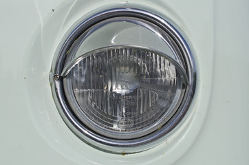 The round head light of the old classic vintage bus. 