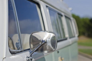 Looking down the side of the classic vintage looking van bus on a summer evening. 