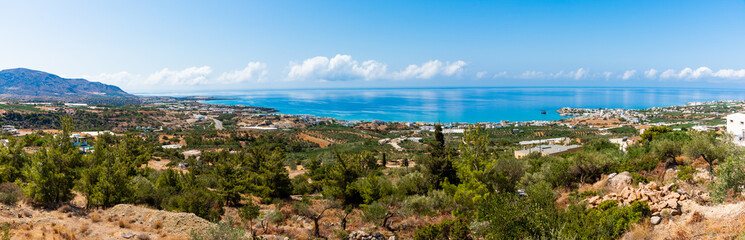 Naklejka na ściany i meble Makrigialos unique skyline aerial view, south east Crete Greece. Popular Mediterranean travel destination vacation resort, unspoiled beaches, clear turquoise ocean waters. Travel destination concept. 