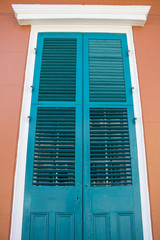 Bright Turquoise Blue Doors on a Peach Building in the French Quarter of New Orleans, Louisiana, USA