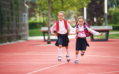 Fototapeta premium Happy children girlfriend schoolgirl student elementary school