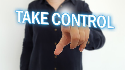 Businesswoman pointing finger on take control text