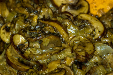 fried with onions and spices Royal mushrooms champignons in a frying pan
