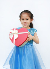 Smiling little child girl receiving red heart gift box isolated on white background.