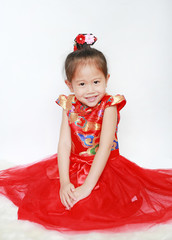 Portrait face of little asian girl in cheongsam on traditional chinese new year festival.