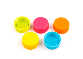 Colorful Plastic bottle caps on white background. selective focus