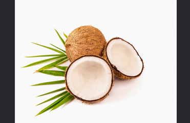 Coconut with half and leaves isolated on white background