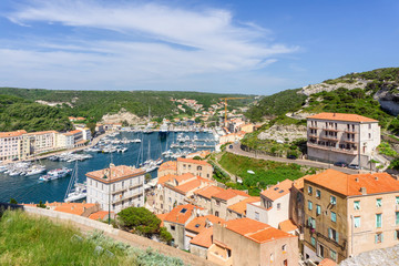 Fototapeta na wymiar Landscape on Corsica island, Beautiful top view of Calvi town with castle on hill in summertime, France