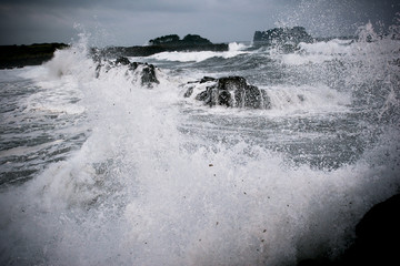 waves crashing on rocks