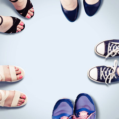 Assorted summer women's shoes. Female feet in shoes. Fashion background.
