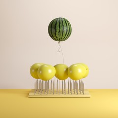 Outstanding watermelon floating on top nail trap on yellow pastel background color. minimal idea concept.