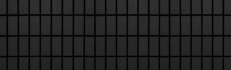 Panorama of Black brick wall pattern and seamless background