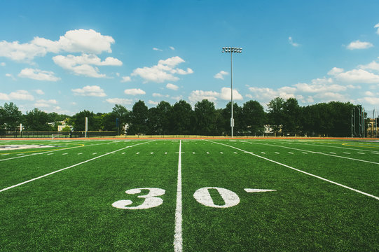 30 Yard Line on American Football Field and blue sky