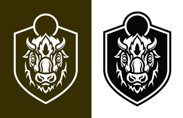 Buffalo short horns head silhouettes on shield © Gala Che